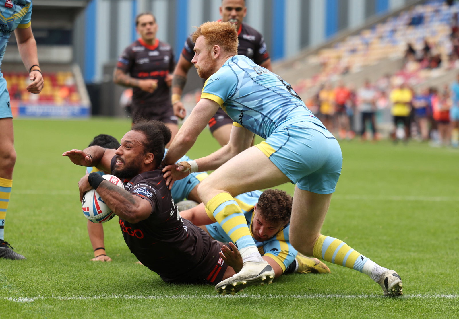 Sheffield Eagles Joel Farrell in action with Newcastle Thunder s Alex Donaghy during the RFL Championship Summer Bash