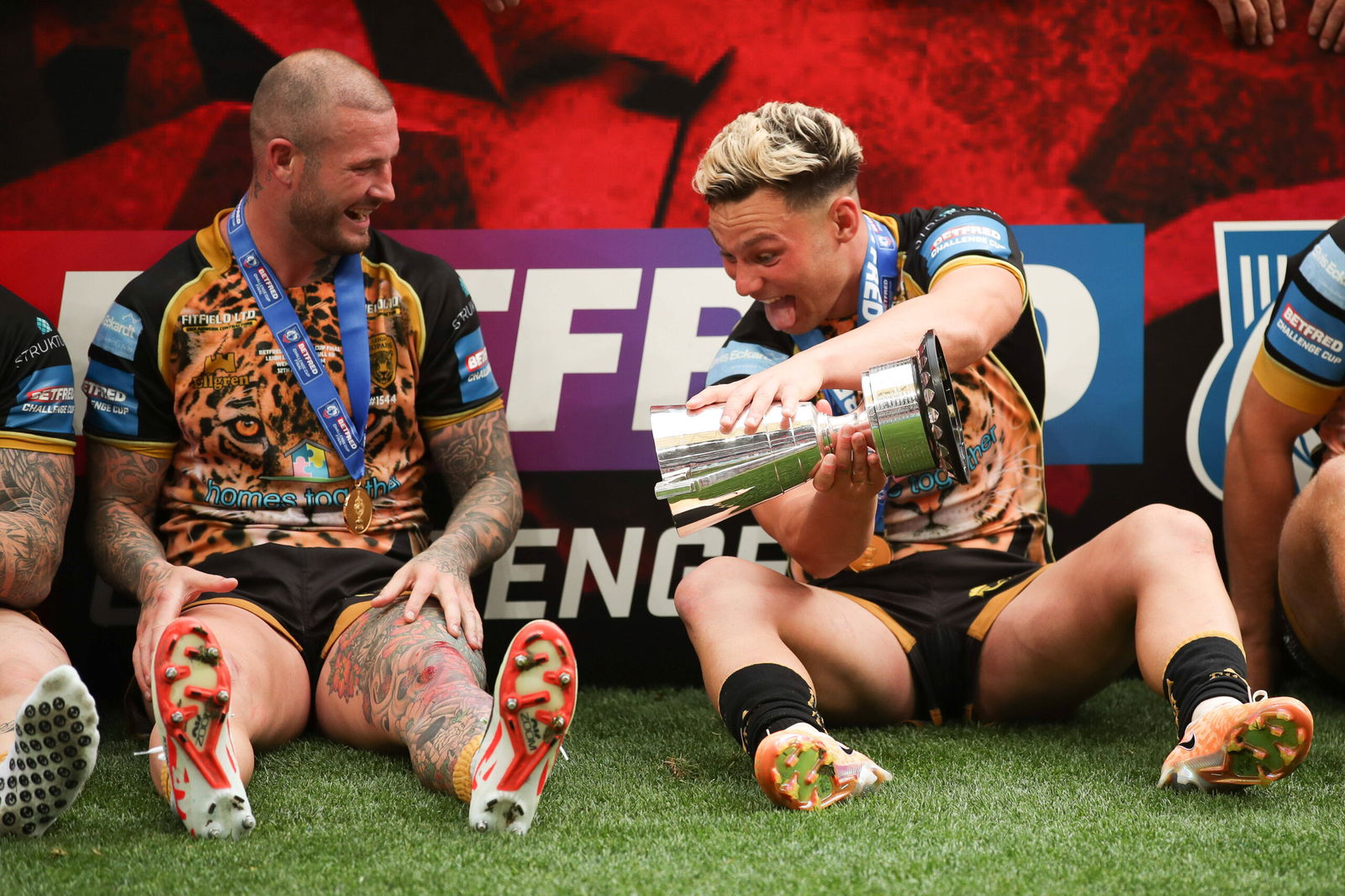 Zak Hardaker of Leigh Leopards and Lachlan Lam of Leigh Leopards share a joke during the celebrations during the Betfred Challenge Cup Final match between Leigh Leopards and Hull KR