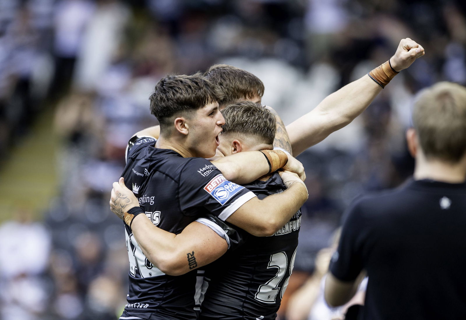 Hull FC players celebrate against Wigan Warriors