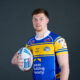 Leeds Rhinos forward Morgan Gannon posing with a rugby ball