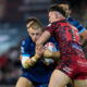 Hull KR's Mikey Lewis being tackled by Leigh Leopards players