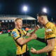 Castleford Tigers coach Danny McGuire whilst players celebrate their win