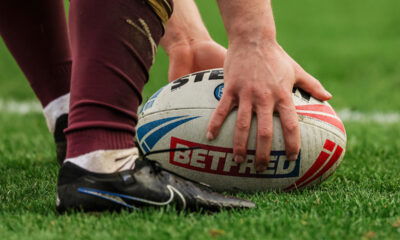 A rugby league ball on the field