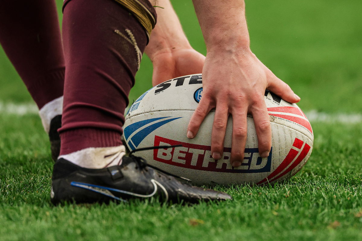 A rugby league ball on the field