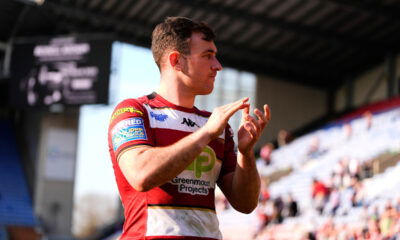 Wigan Warriors halback Harry Smith applauds the fans