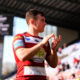 Wigan Warriors halback Harry Smith applauds the fans