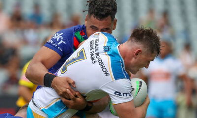 NRL player AJ Brimson in a tackle