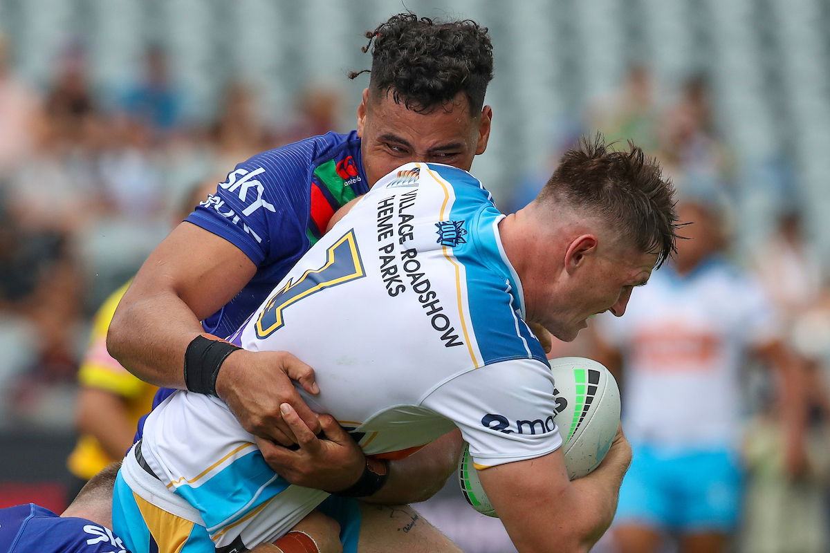 NRL player AJ Brimson in a tackle