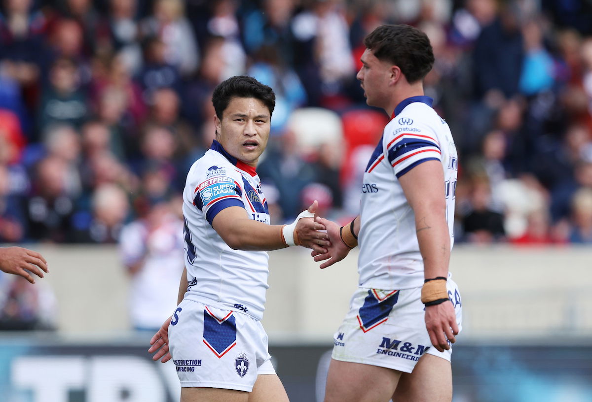 Wakefield Trinity halfback Mason Lino celebrates with teammate