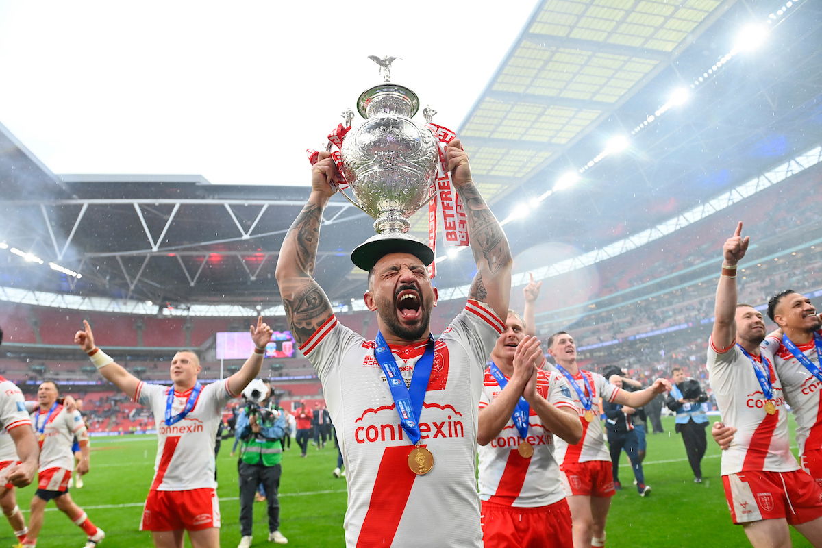 Hull KR captain Elliot Minchella lifting the Challenge Cup trophy