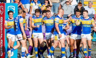 Leeds Rhinos side celebrate scoring a try