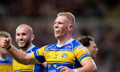 Leeds Rhinos prop Tom Holroyd celebrates scoring a try