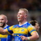 Leeds Rhinos prop Tom Holroyd celebrates scoring a try