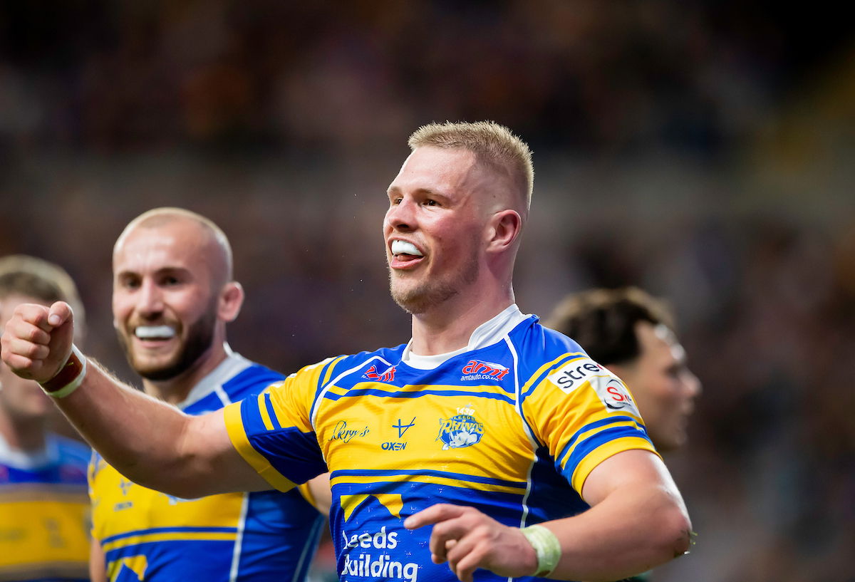 Leeds Rhinos prop Tom Holroyd celebrates scoring a try