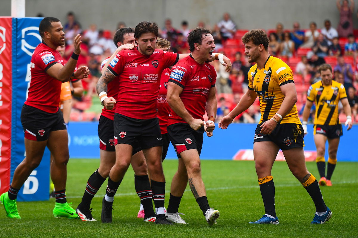 Rugby league fans react to Salford Red Devils victory as players celebrate a try