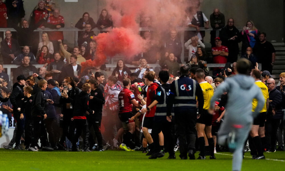 Salford Red Devils fans invade pitch during Wakefield Trinity clash ...
